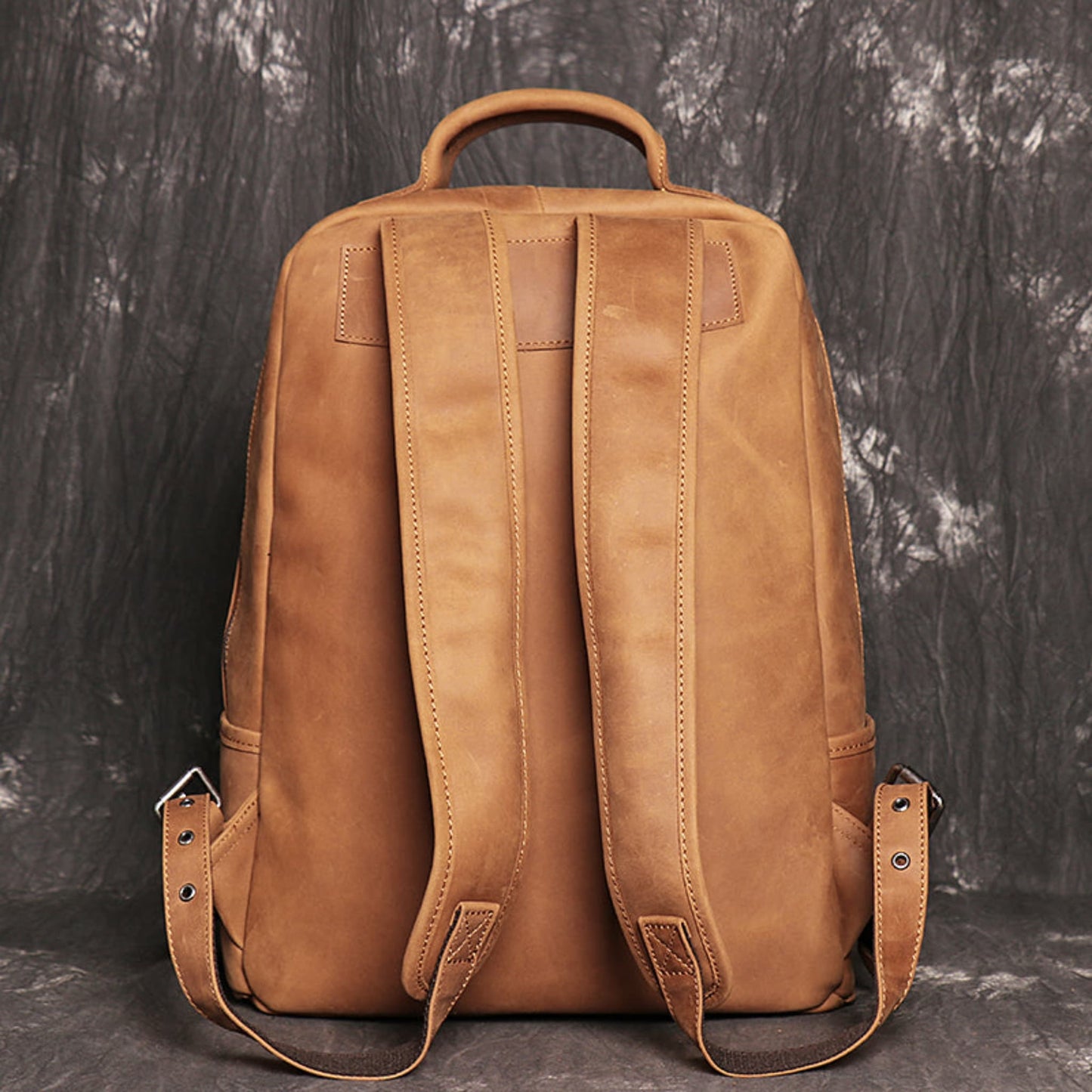 Avenue Brown Yellow Retro Crazy Horse leather backpack for men – back view showing padded shoulder straps, top carry handle, and adjustable strap buckles