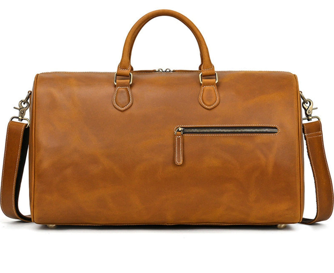 Full-grain cowhide leather duffle bag by Avenue — rich tan colour showcasing natural leather texture and patina
