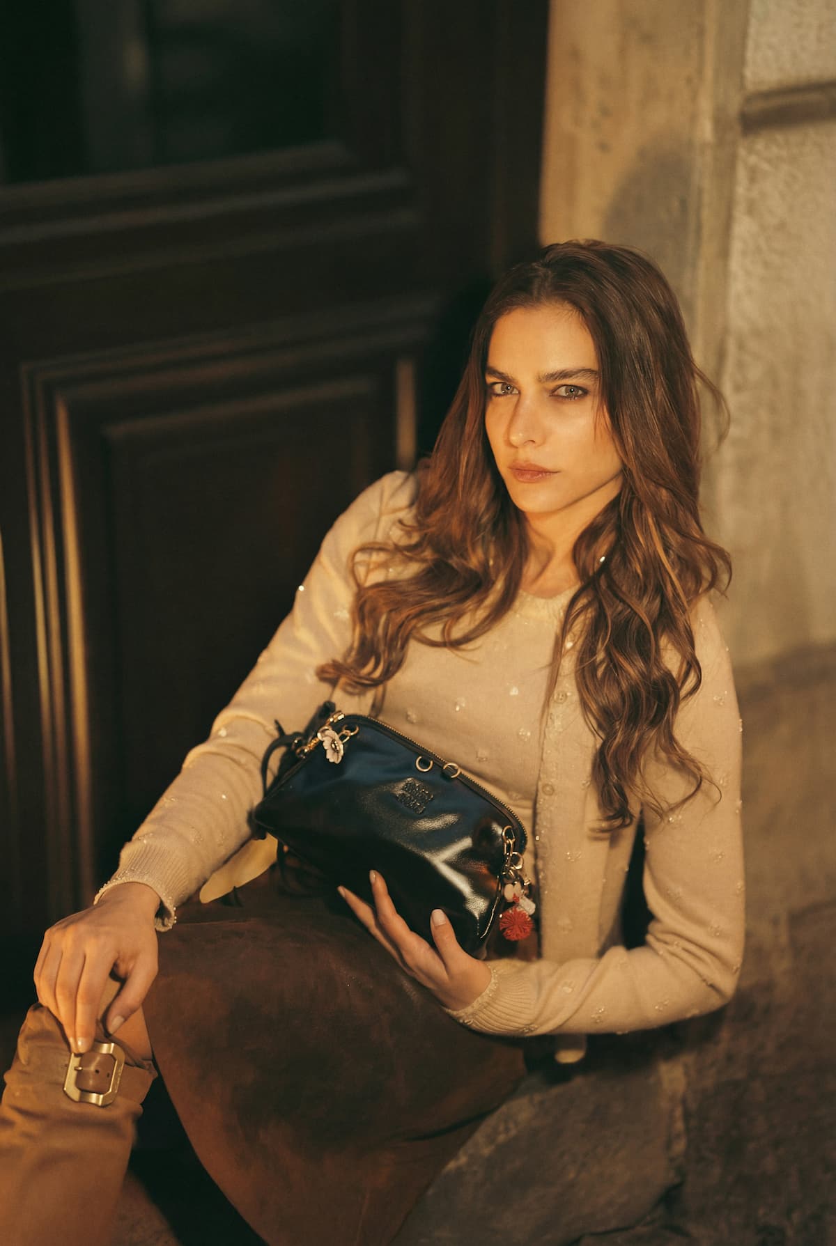 Woman holding premium leather bag with belt — Avenue Best Sellers