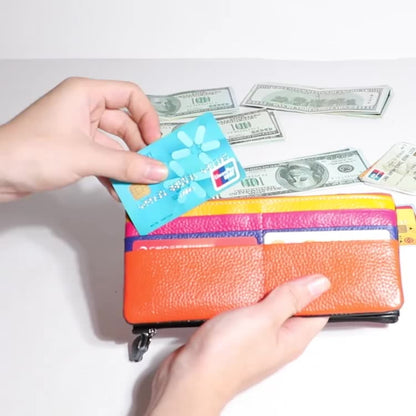 Women's RFID blocking genuine cowhide long leather wallet - hand holding view showing interior card slots | Avenue