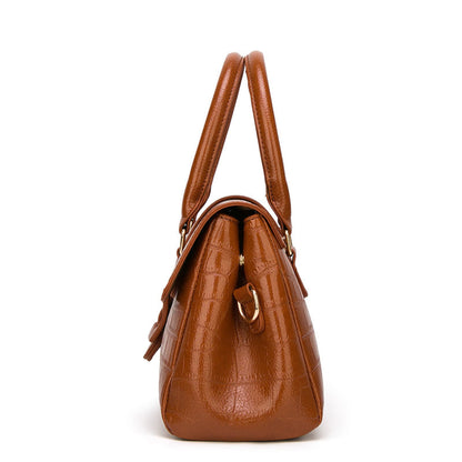 Women's Crocodile Pattern Leather Handbag in Brown with Top Handles and Gold Hardware – Side View | Avenue