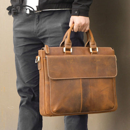 Men's Retro Crazy Horse Leather Crossbody Bag in Light Brown – Lifestyle Shot Carried by Hand Side View | Avenue