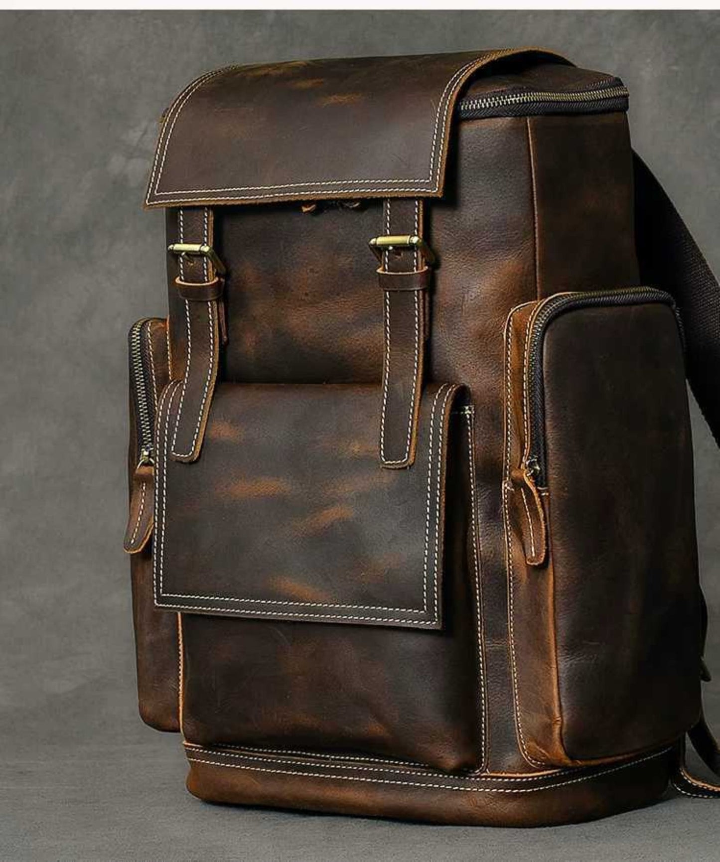 Retro crazy horse leather Men's laptop backpack large capacity in dark brown on grey background – side view showing side pocket | Avenue