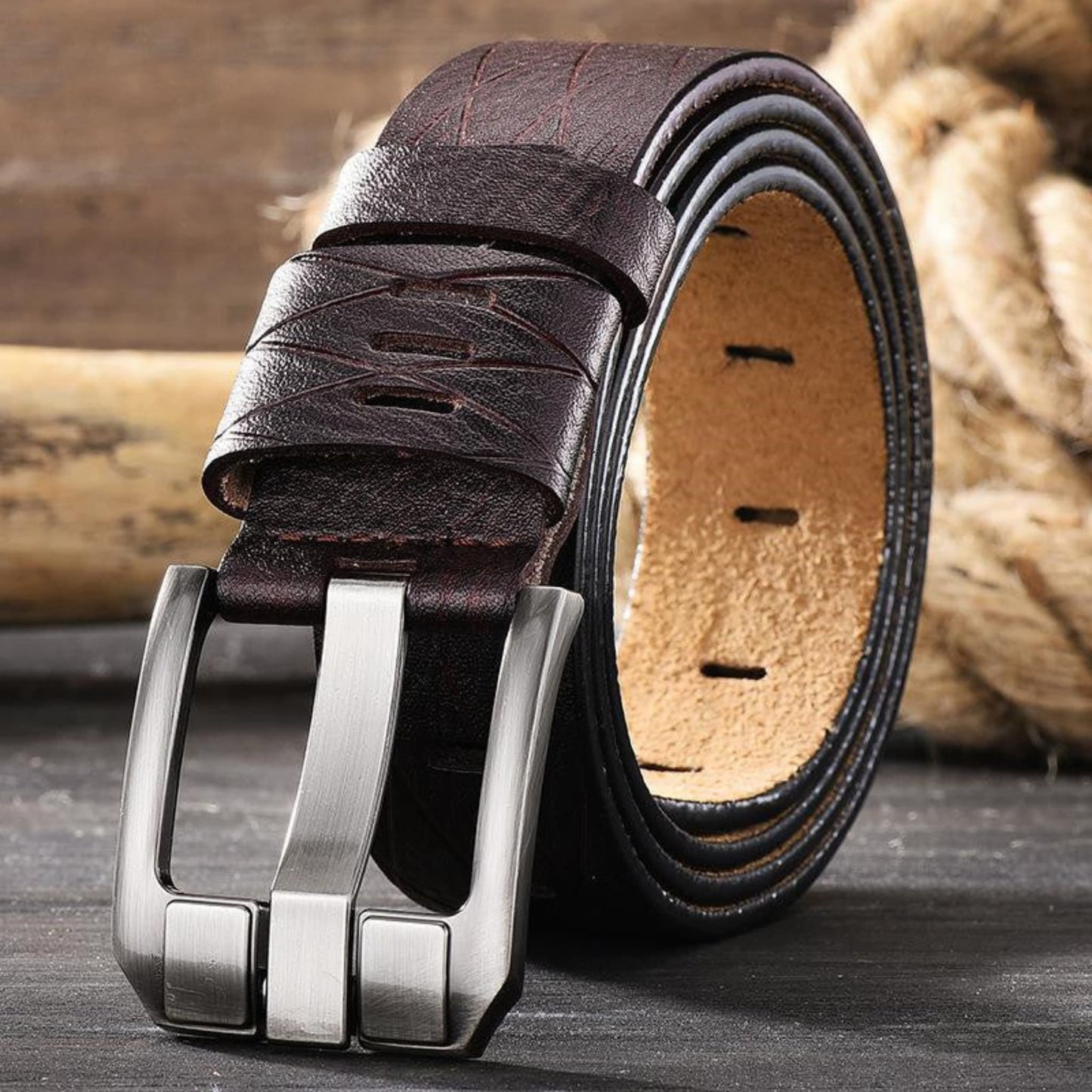 Men's double-layer cowhide brown leather belt with silver buckle on wooden surface | Avenue