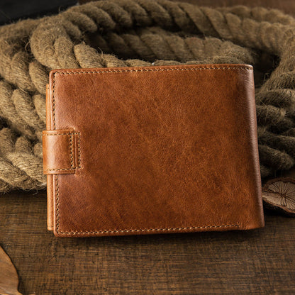 Avenue Men's Short Leather Wallet – Genuine Cowhide in Brown, back view with snap closure, displayed on rustic rope and wooden surface