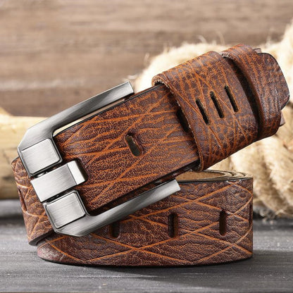 Men's double-layer cowhide light brown leather belt rolled with silver buckle placed on top on wooden surface | Avenue