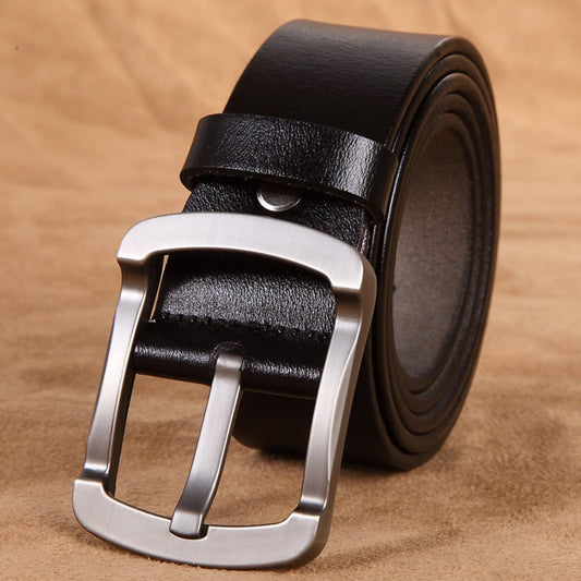 Avenue Men's Genuine Cowhide Leather Retro Belt in Black with brushed gunmetal pin buckle, rolled view on tan leather background