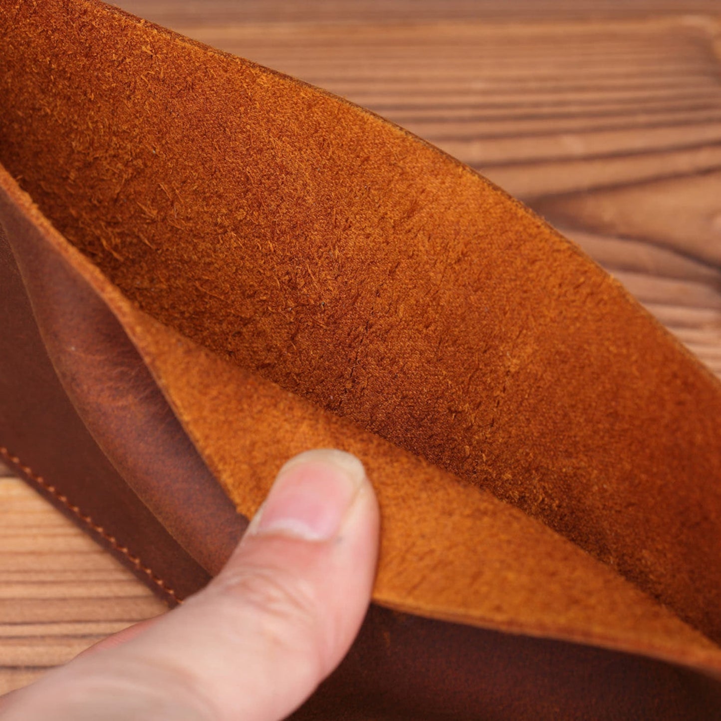 Men's Handmade Crazy Horse Leather Wallet in brown — close-up of natural suede inner lining showing premium first-layer cowhide texture on a wooden surface | Avenue