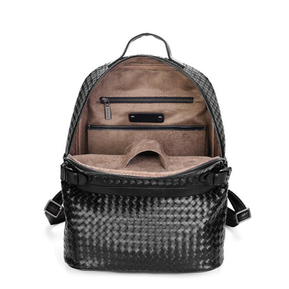 Interior view of black braided leather backpack – showing flocking lining, zipper pocket and open main compartment | Avenue