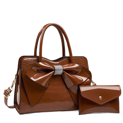 coffee patent leather bow bucket bag and matching wallet | Avenue