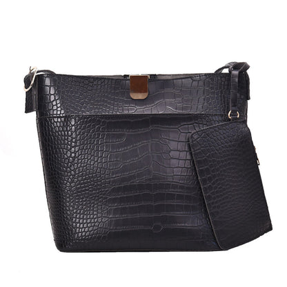 Women's one shoulder bucket bag in black, croc-embossed PU leather with magnetic snap closure, attached mini pouch and gold hardware, white background | Avenue