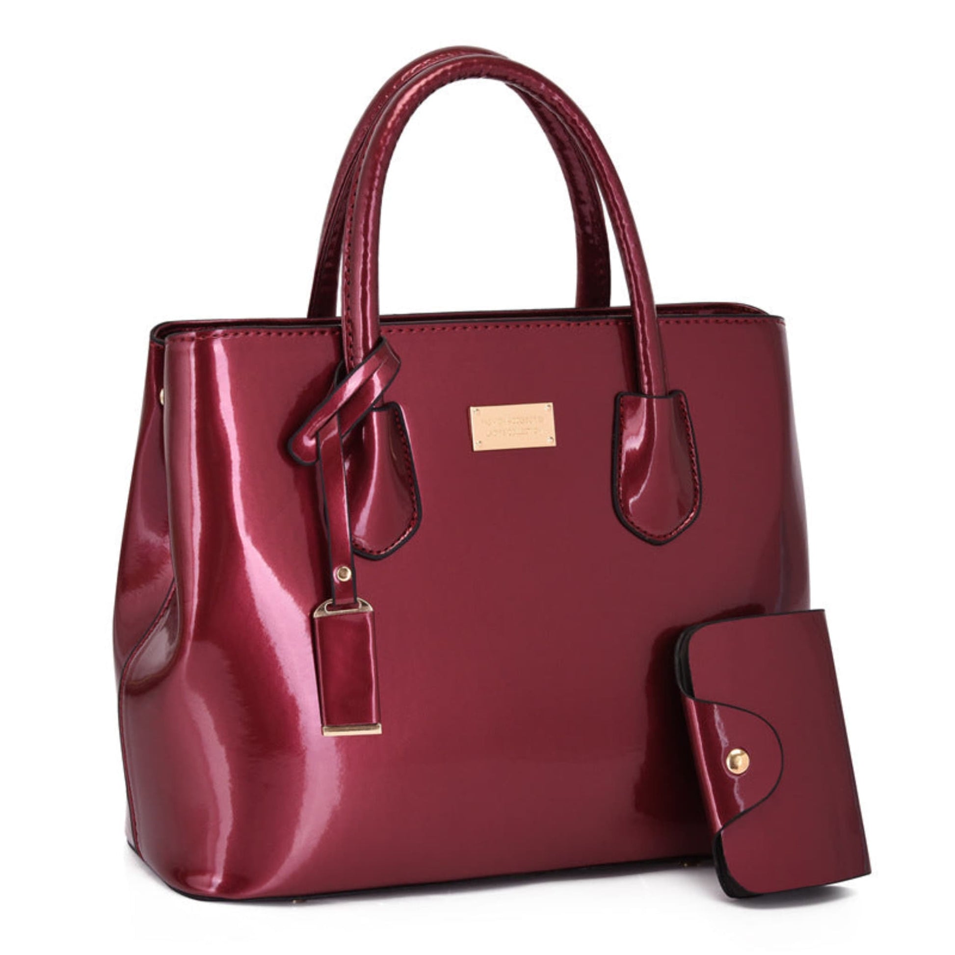 Women's glossy PU leather tote bag and pouch set in red, gold hardware detail, white background | Avenue
