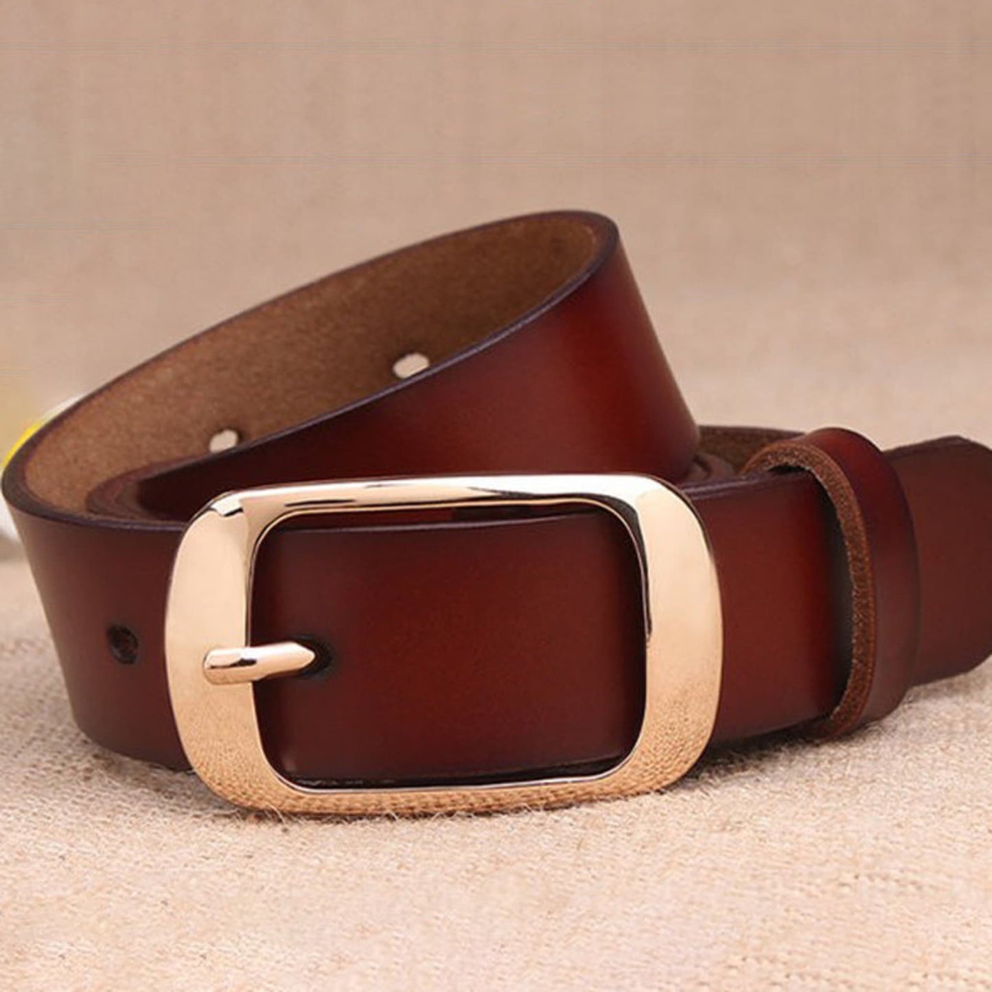 Women's brown leather fashion belt with gold buckle, loose open loop showing adjustment holes –Avenue