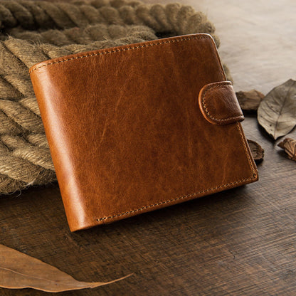 Avenue Men's Short Leather Wallet – Genuine Cowhide in Brown, front angled view with snap closure, displayed on rustic rope and wooden surface