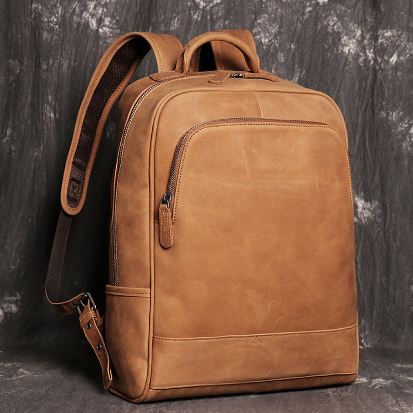 Avenue Brown Yellow Retro Crazy Horse leather backpack for men – front view showing zipper pocket, dual top handles, and padded shoulder straps