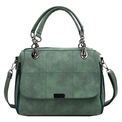 Women's green matte PU leather large capacity Boston shoulder tote bag with dual top handles, silver chain hardware, quilted stitch detail, front flap closure, and adjustable crossbody strap — Avenue