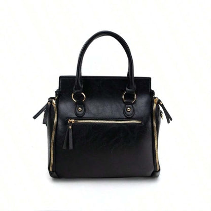 Ladies glossy vintage tote bag in black with gold accents and zipper, front view on white background | Avenue