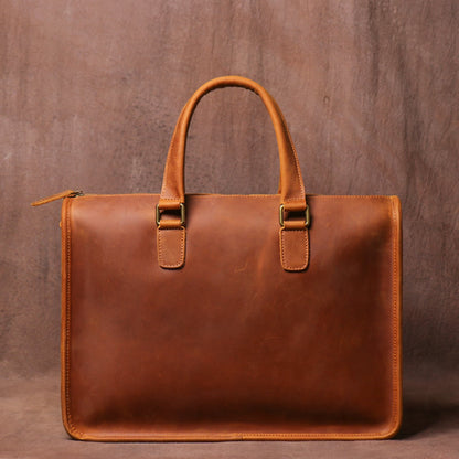 Men's Crazy Horse Leather Briefcase | Vintage Laptop Bag – Vintage Brown Front View with Top Handle, Antique Brass Hooks and Side Zipper Closure on Vintage Brown Textured Background by Avenue