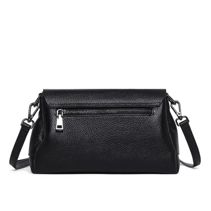 woMen's soft leather shoulder messenger bag in black on white background back view with zipper pocket| Avenue