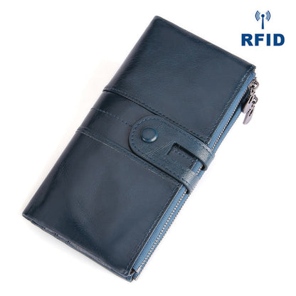 Women's RFID Long Leather Wallet first layer cowhide in Blue with Fastening Strap and Zipper — angled top view | Avenue