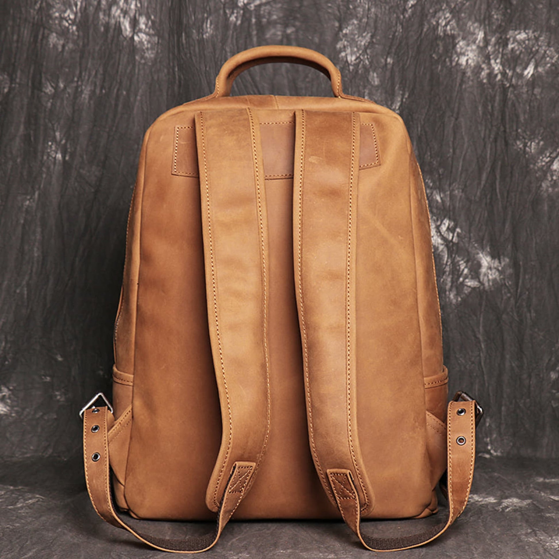 Avenue Brown Yellow Retro Crazy Horse leather backpack for men – back view showing padded shoulder straps, top carry handle, and adjustable strap buckles