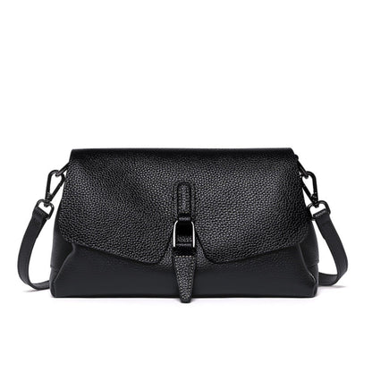 woMen's soft leather shoulder messenger bag in black on white background front view | Avenue