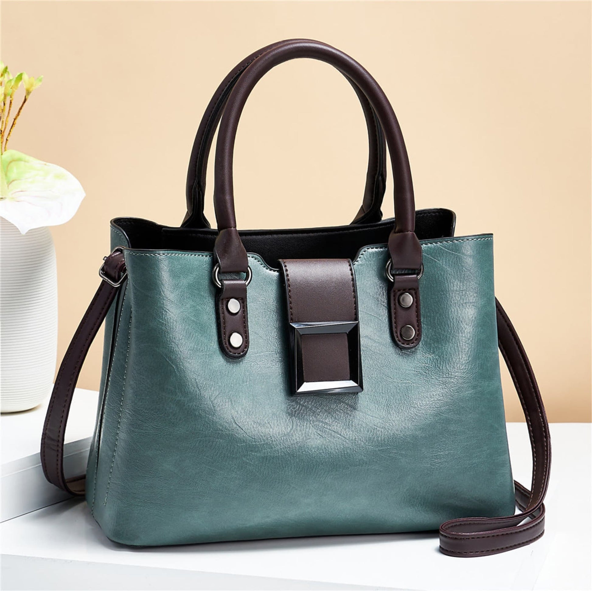 woMen's lychee pattern structured PU leather handbag in Mint Green with brown accents on light background | Avenue