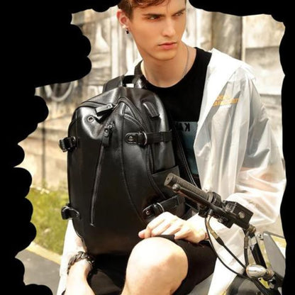 Man in white raincoat on motorcycle wearing a black Men's leather backpack with USB charging port – lifestyle view | Avenue
