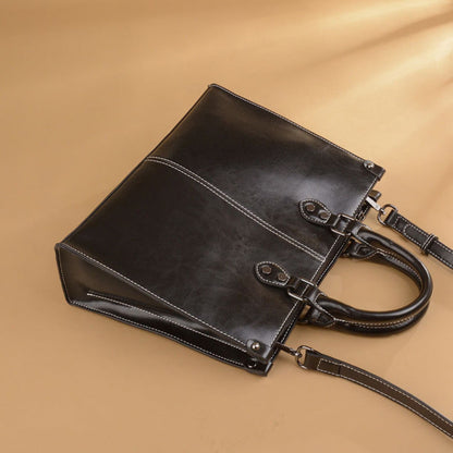 Women's Genuine Cowhide Leather Crossbody Handbag in Black – Side View Showing Stitching Detail and Hardware – Avenue