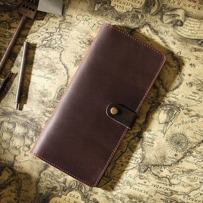 Avenue Retro Crazy Horse Leather Long Wallet in Coffee – Unisex Genuine Leather Wallet with Brass Snap Closure, styled on a vintage world map with leather crafting tools