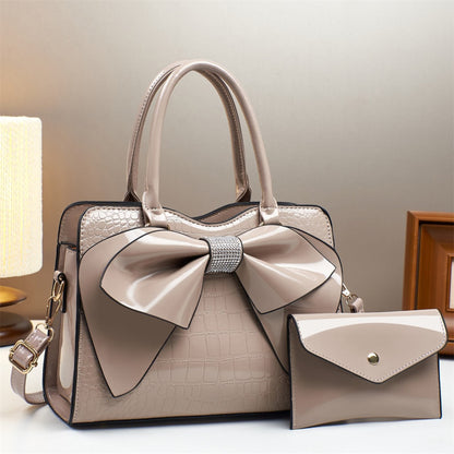 khaki patent leather bow bucket bag and matching wallet | Avenue