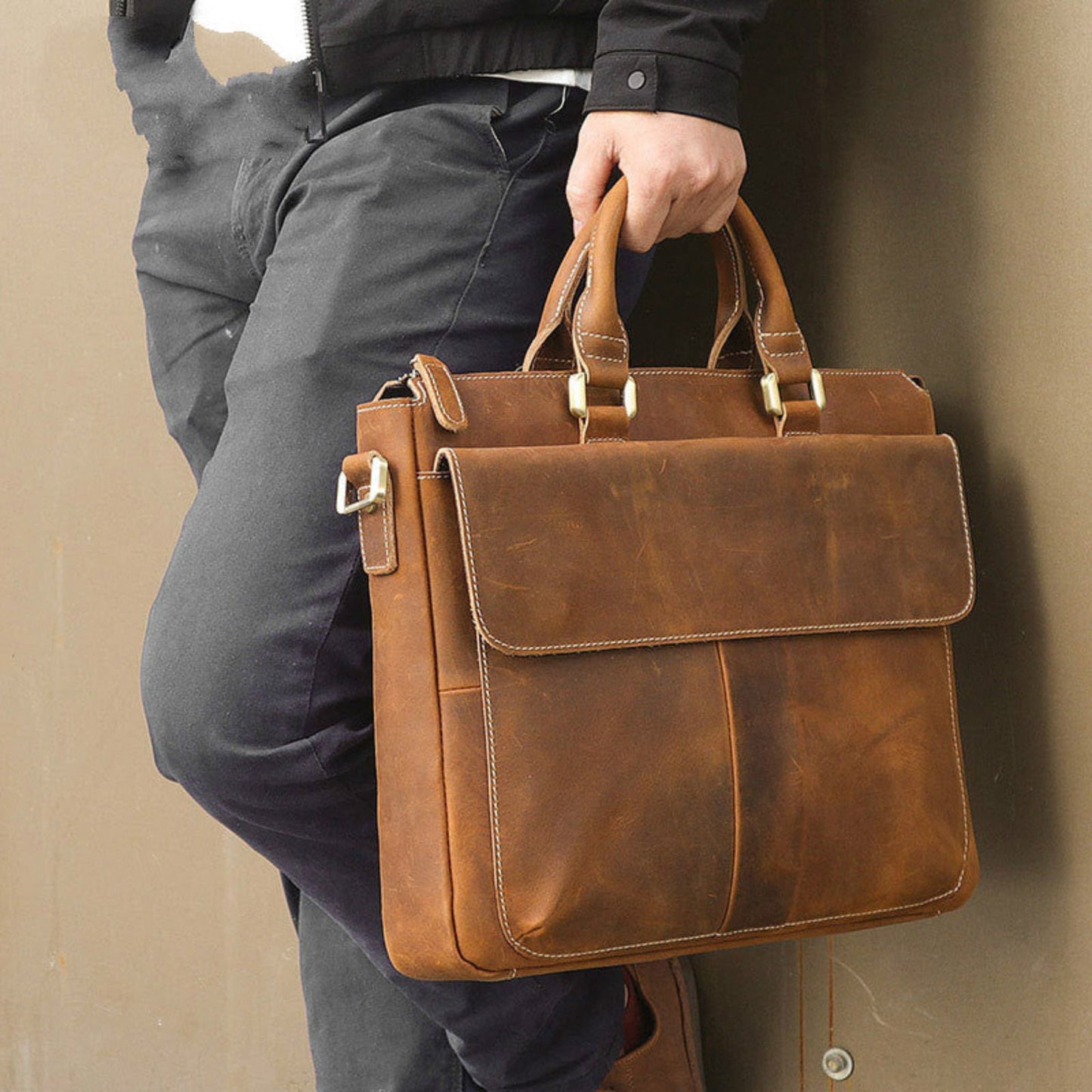Men's Retro Crazy Horse Leather Crossbody Bag in Light Brown – Lifestyle Shot Carried by Hand | Avenue