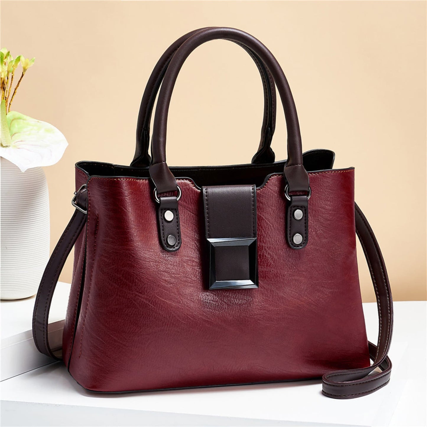 woMen's lychee pattern structured PU leather handbag in Red with brown accents on light background | Avenue
