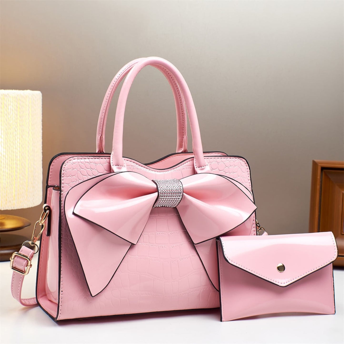 pink patent leather bow bucket bag and matching wallet | Avenue