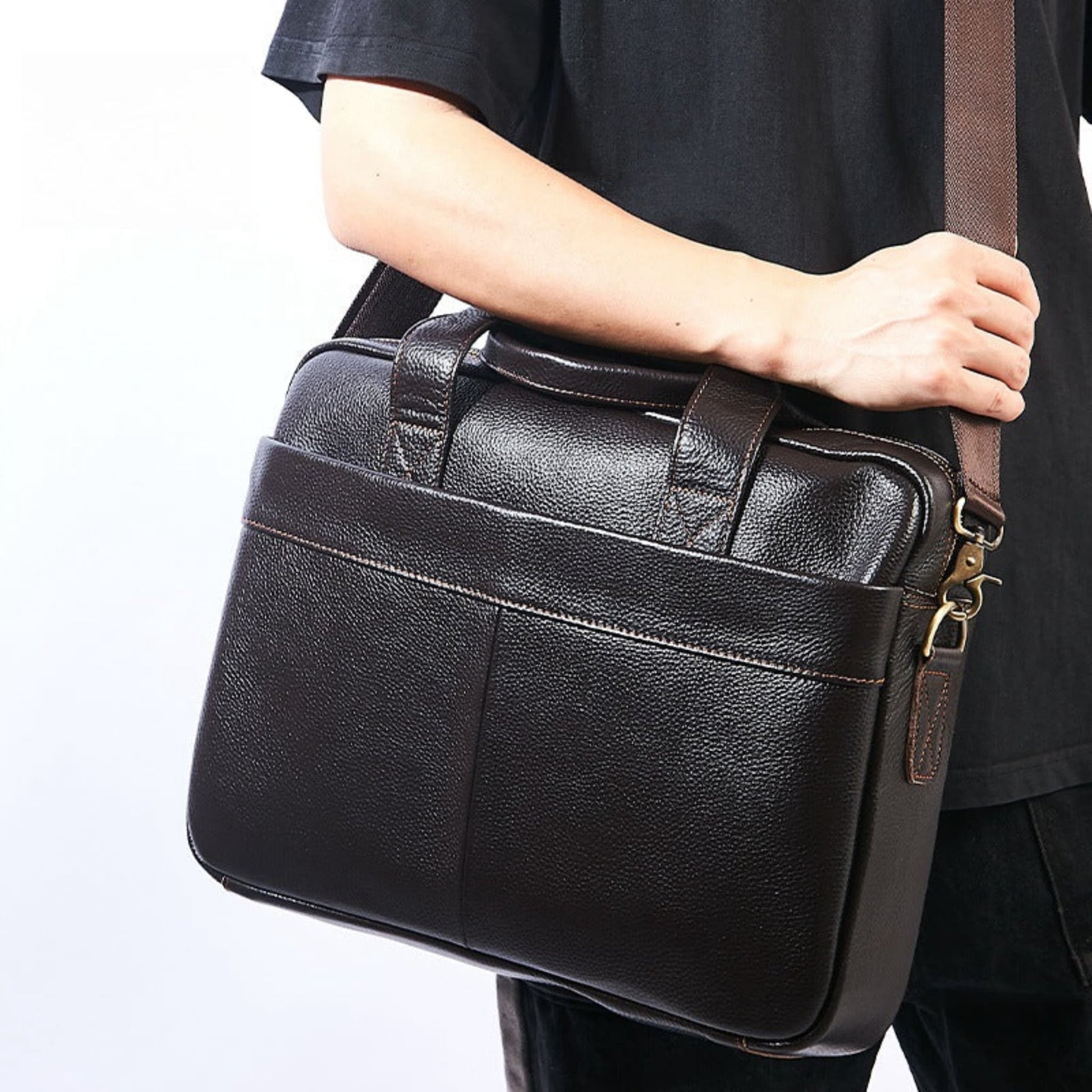 Men's Genuine Leather Crossbody Bag in Brown – Lifestyle Shot of Man Carrying Bag on Shoulder Strap | Avenue