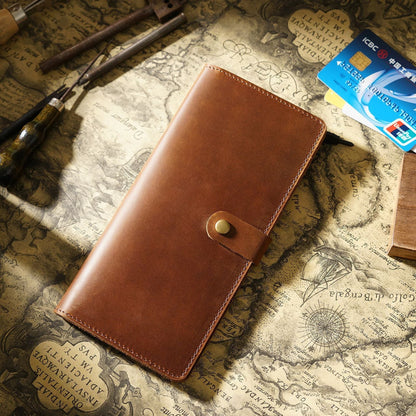 Avenue Retro Crazy Horse Leather Long Wallet in Brown – Unisex Genuine Leather Wallet with Brass Snap Closure, styled on a vintage world map with leather crafting tools