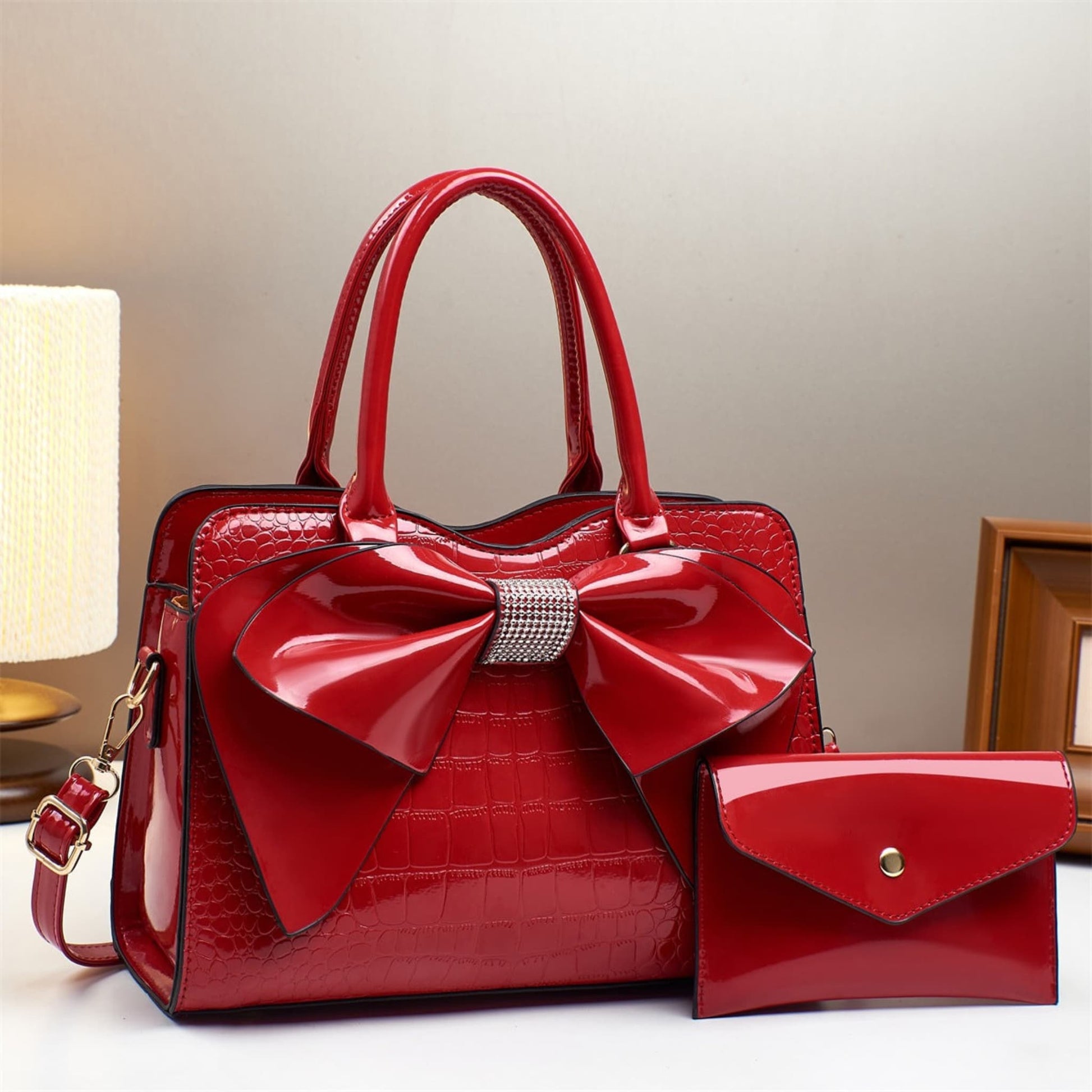 red patent leather bow bucket bag and matching wallet | Avenue