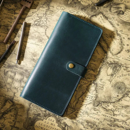 Avenue Retro Crazy Horse Leather Long Wallet in Blue – Unisex Genuine Leather Wallet with Brass Snap Closure, styled on a vintage world map with leather crafting tools