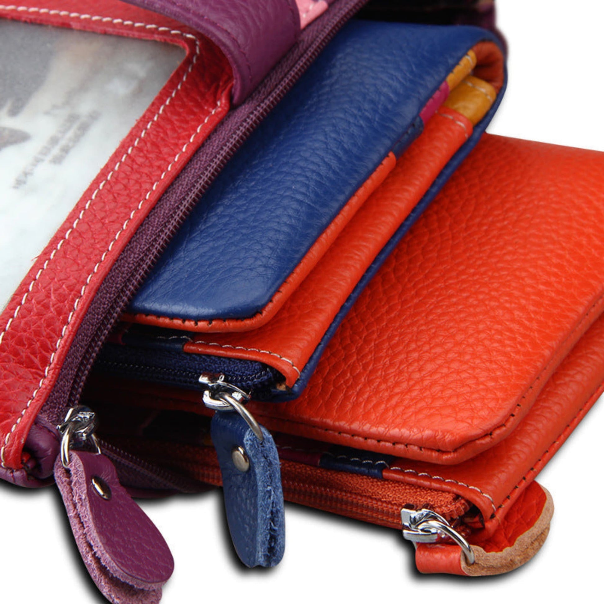 Women's RFID blocking genuine cowhide long leather wallets in three colours stacked on a white background | Avenue