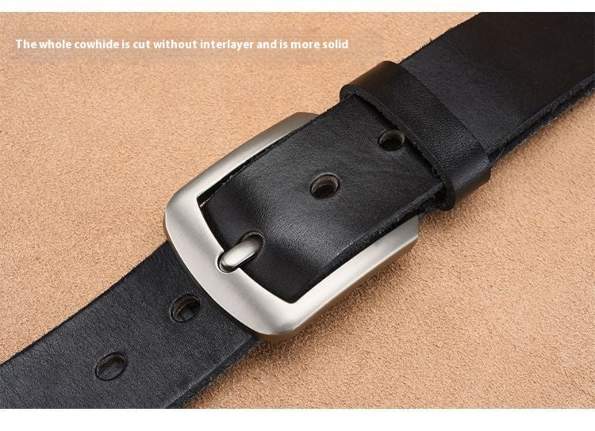 Premium Genuine Leather Pin Buckle Belt for Men in Black — flat lay macro showing silver pin buckle fastened through belt hole with punch holes and full-cut cowhide strap edge detail on tan background | Avenue