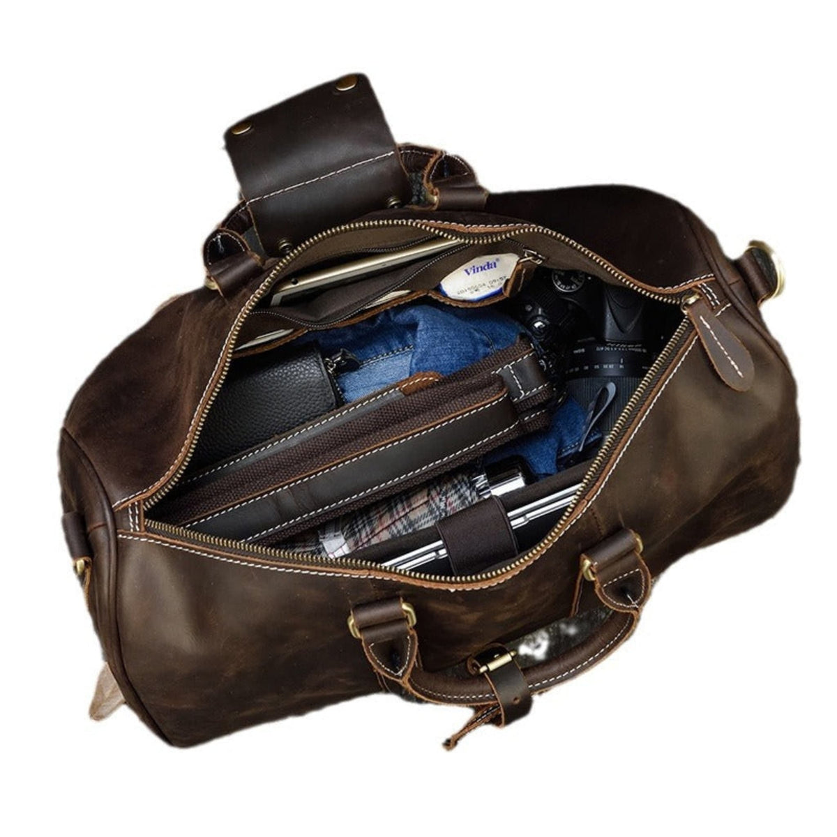 Avenue Retro Crazy Horse Leather Travel Bag in Dark Brown — top view showing large capacity interior with wallet, jeans, camera, umbrella and travel essentials — genuine leather duffle bag — white background