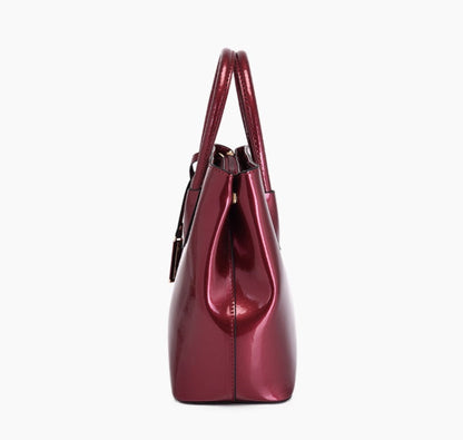 Women's glossy PU leather tote bag side view in red, zipper closure detail, white background | Avenue