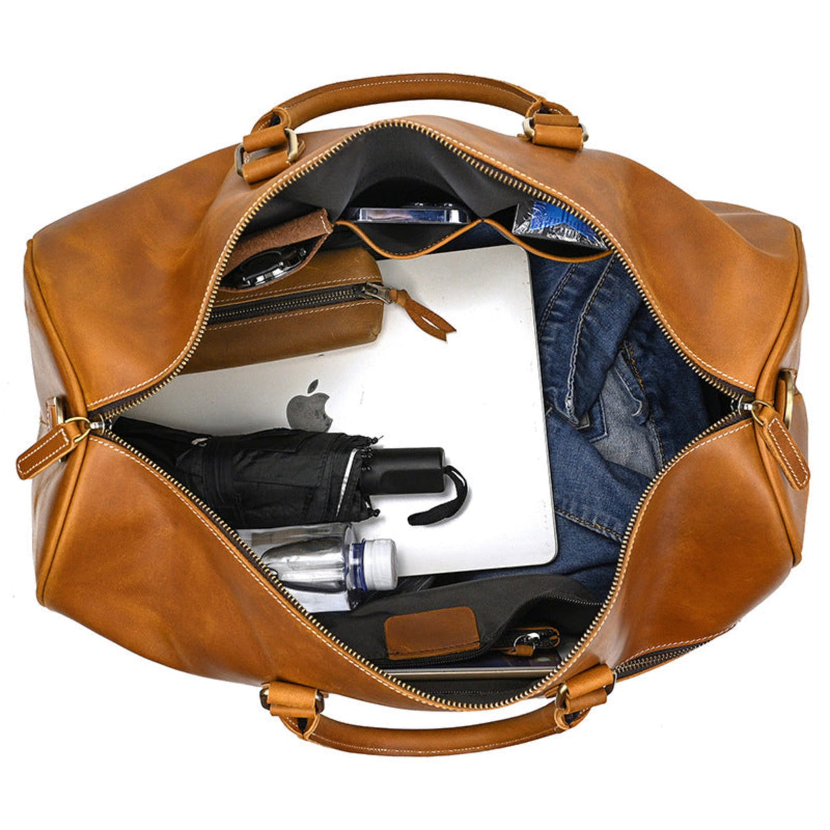 Avenue Retro Crazy Horse Leather Travel Bag in Light Brown — top view showing large capacity interior with laptop, jeans, umbrella and accessories — genuine leather duffle bag — white background