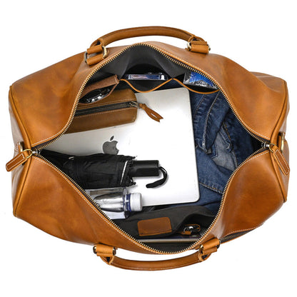 Avenue Retro Crazy Horse Leather Travel Bag in Light Brown — top view showing large capacity interior with laptop, jeans, umbrella and accessories — genuine leather duffle bag — white background