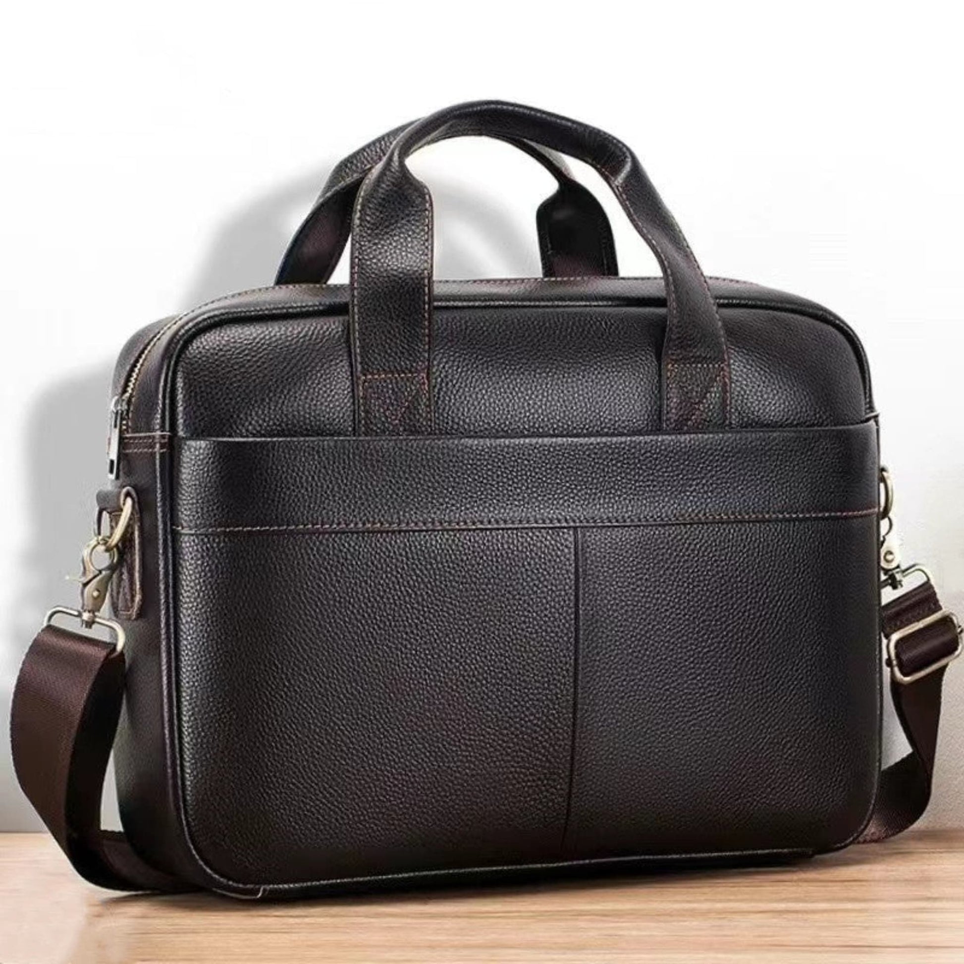 Men's Genuine Leather Crossbody Bag in Brown with Top Handles and Adjustable Shoulder Strap – Front View on Wooden Surface | Avenue