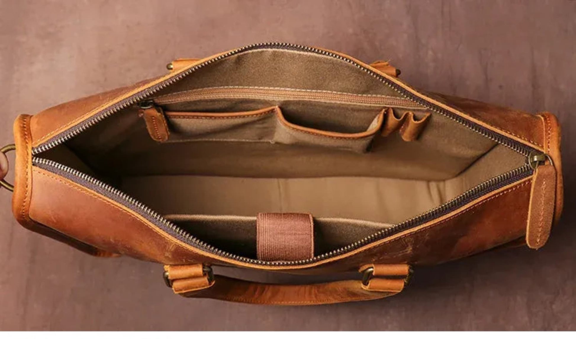 Men's Crazy Horse Leather Briefcase | Vintage Laptop Bag – Vintage Brown Interior View Showing Olive Fabric Lining, Zipper Pocket, Organizer Slots, Antique Brass Zipper and Antique Brass Hooks on Brown Textured Background by Avenue