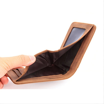 Premium Men's RFID leather wallet in Earthy yellow held open showing interior | Avenue